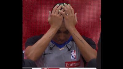 Sha'Rae Mitchell clutching her head in pain