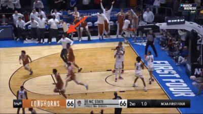 Texas assistant Ryan Anderson storms the court too early