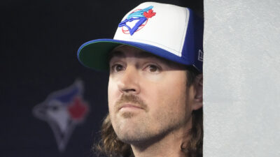 Kevin Gausman wearing a Blue Jays cap