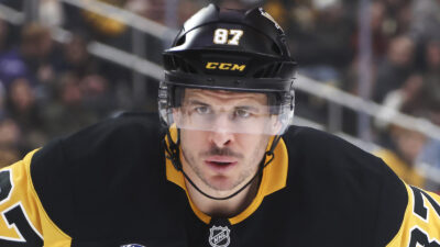 Sidney Crosby looking on