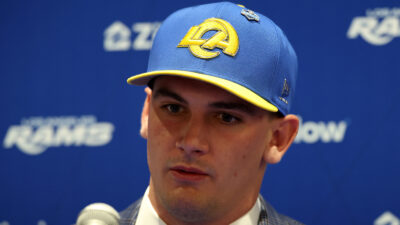 Ty Simpson wearing a Rams hat