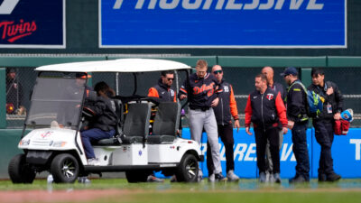 Tigers' Parker Meadows carted off after outfield collision.