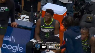 Anthony Edwards laughing on the bench