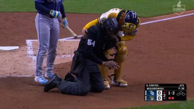 CB Bucknor takes foul ball to mask