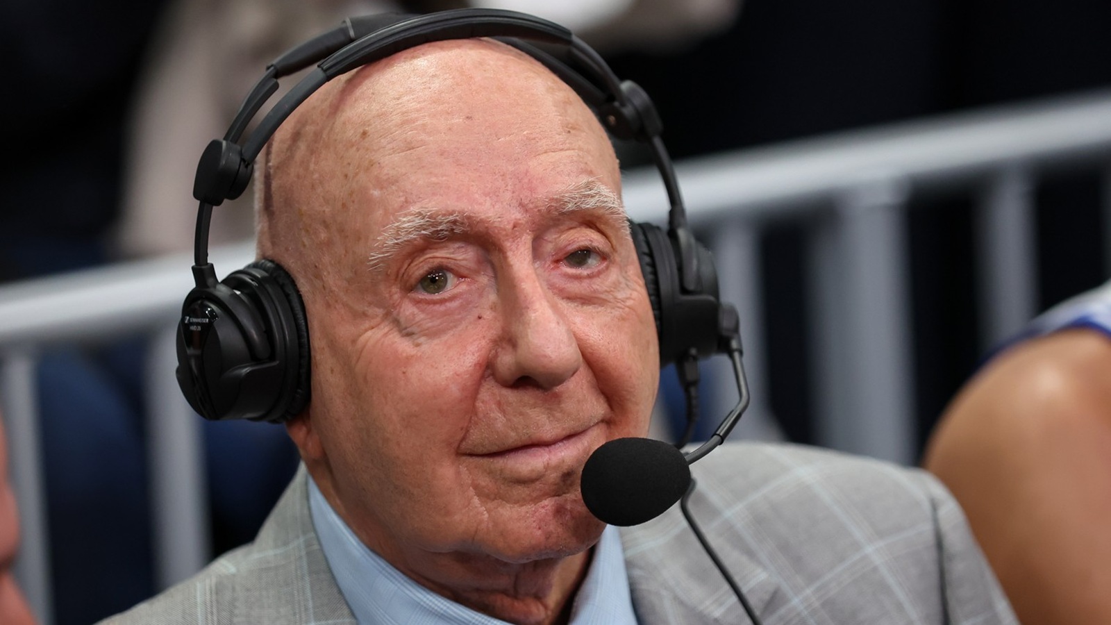 Dick Vitale with a headset on