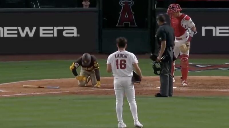 Jake Cronenworth in pain after getting hit by a pitch from Yusei Kikuchi