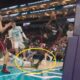 LaMelo Ball grabbing Bam Adebayo's leg