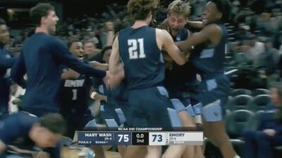 Mary Washington forward Colin Mitchell gets mobbed by teammates after beating Emory for the Division III national title.