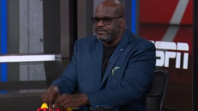 Shaq holding a plush figure