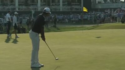 Aaron Rai on the green