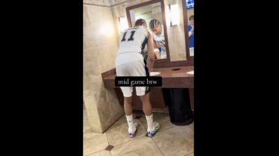 Spurs rookie Carter Bryant washing his hands in a public bathroom during Game 2 against the Thunder