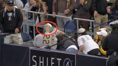 A's infielder Jeff McNeil hits a Padres fan in the face with his cleats