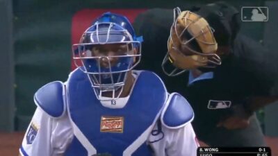 Laz Diaz staring at Salvador Perez