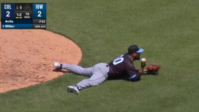 Pedro Avila laying on the infield grass