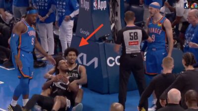 Dylan Harper holding down Stephon Castle as the latter glared at Alex Caruso during Spurs-Thunder Game 7
