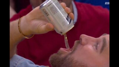 Travis Kelce chugging beer