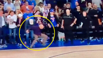 Larry David reacts to a missed shot by Josh Hart