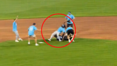 Rhamondre Stevenson falls during a softball game