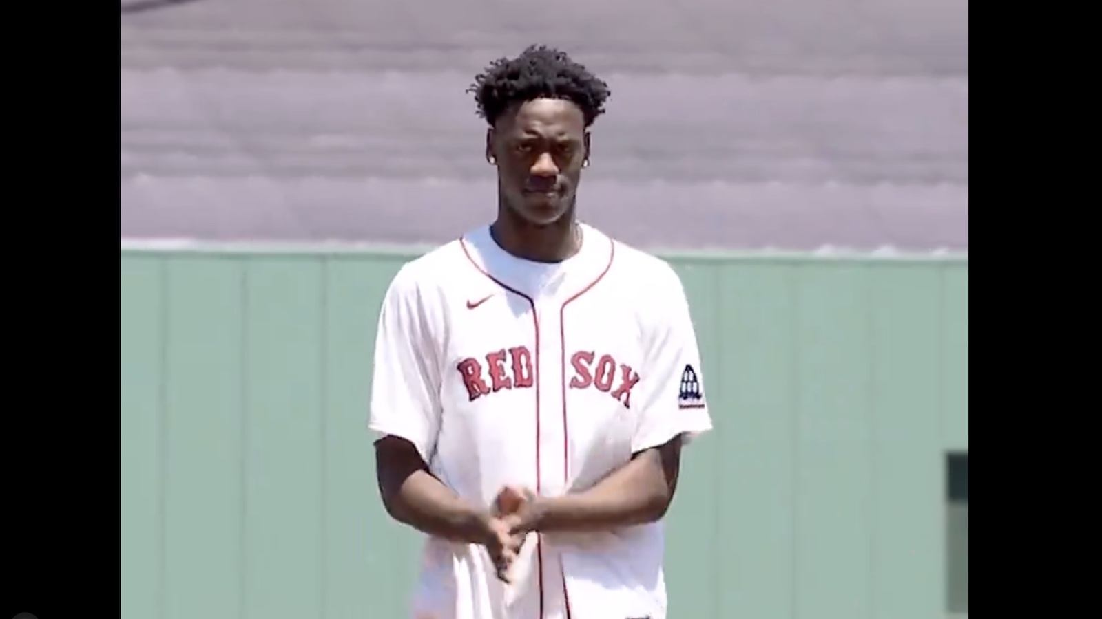 AJ Dybantsa in a Red Sox jersey throwing out the first pitch
