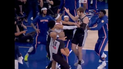 Knicks wing Josh Hart shoves Spurs center Luke Kornet during Game 3 of the NBA Finals