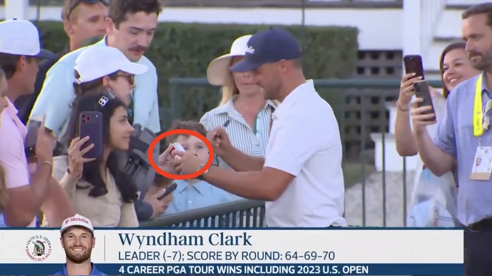 Wyndham Clark signing a Diet Coke can at the U.S. Open