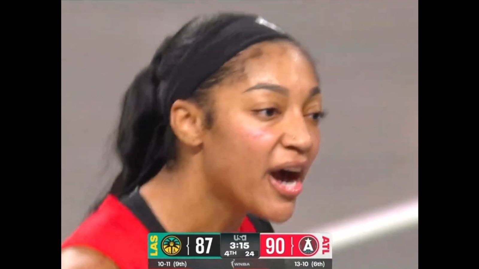 Angel Reese yelling at a fan