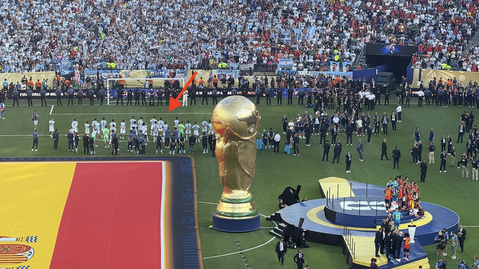 Argentina players with their backs turned on Spain during World Cup trophy presentation