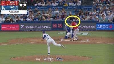 Red Sox batter Willson Contreras getting hit by a pitch in the helmet