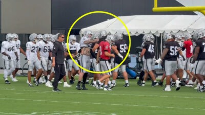 Maxx Crosby taps Kirk Cousins' helmet