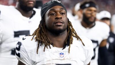 Raiders running back Ashton Jeanty looking on