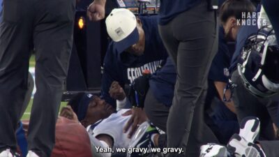 Bud Clark being attended to by a Seahawks training after suffering an ankle injury