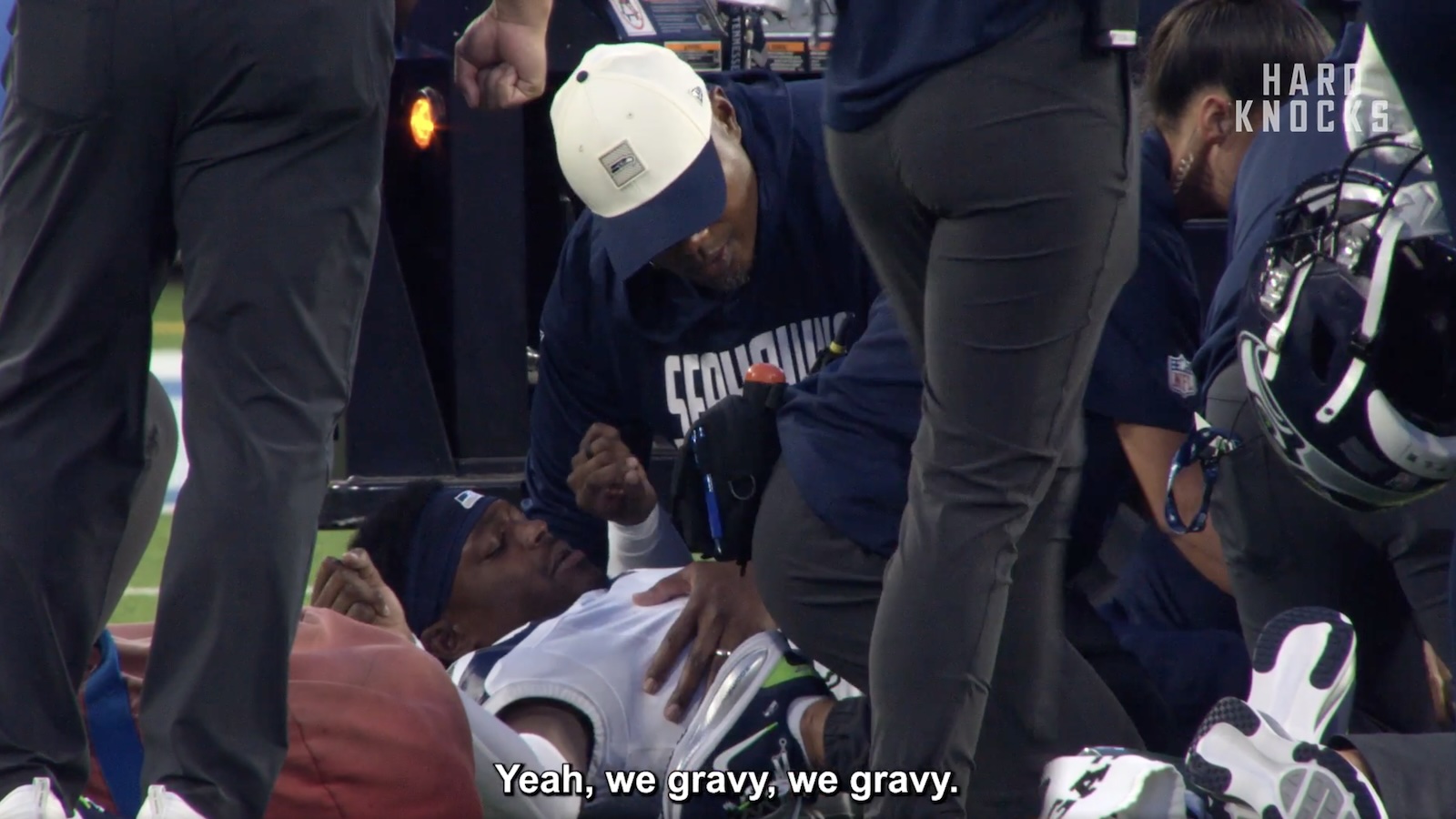 Bud Clark being attended to by a Seahawks training after suffering an ankle injury