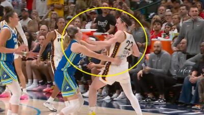 Caitlin Clark pushing Paige Bueckers