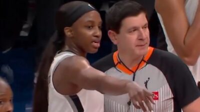Jackie Young pointing out a fan