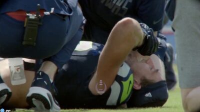 Seahawks wide receiver Jake Bobo in pain after suffering a knee injury