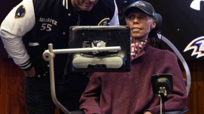 OJ Brigance wearing a Ravens cap