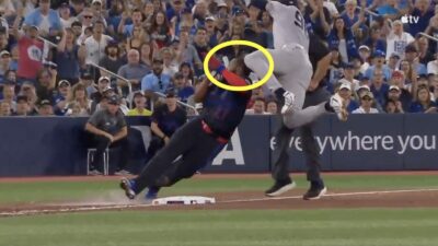 Blue Jays star Vladimir Guerrero Jr. being kneed in the head by Yankees shortstop George Lombard Jr.
