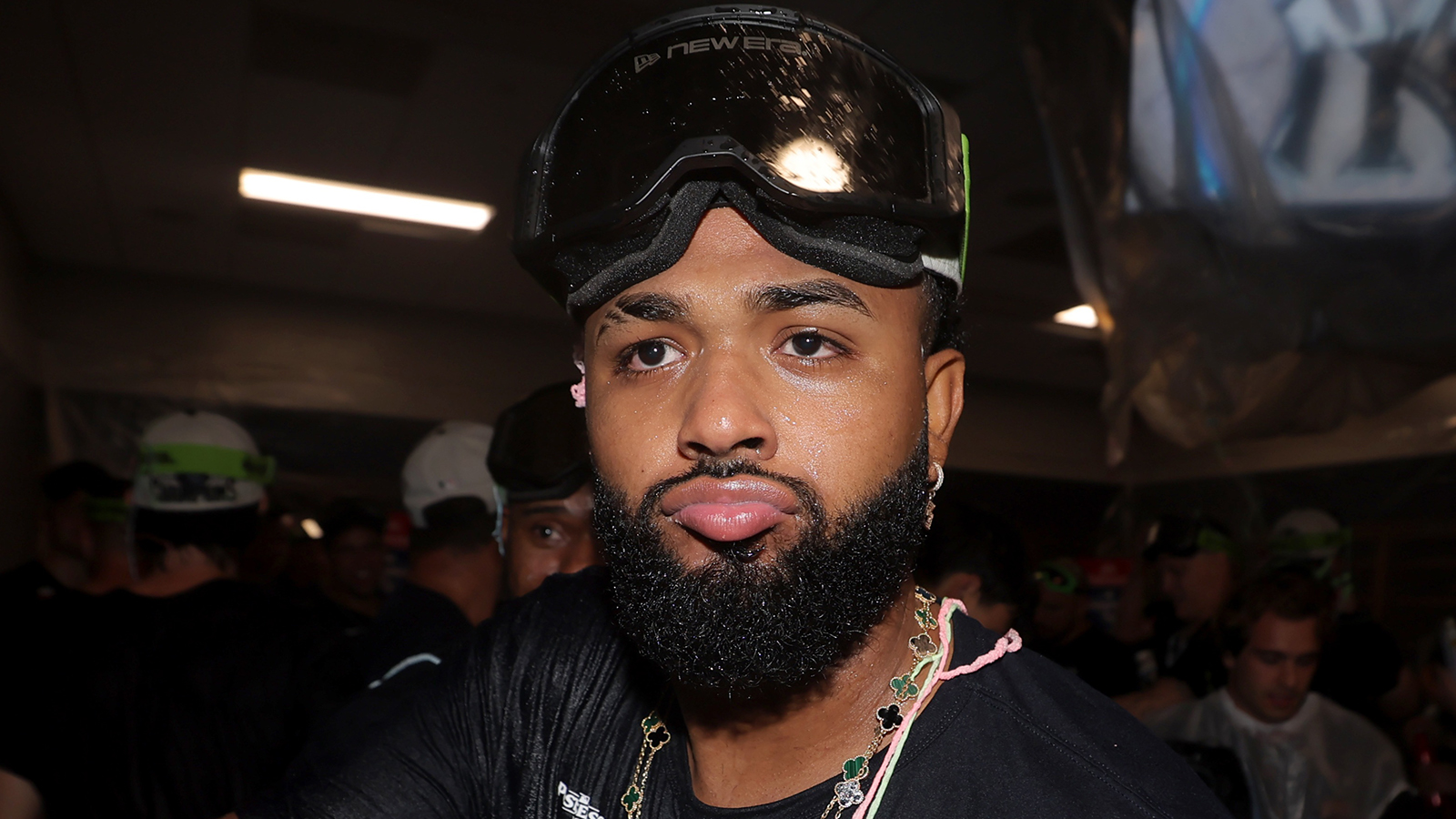 Rays third baseman Junior Caminero (13) celebrates in the locker room