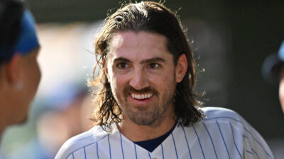 Cubs pitcher Kevin Gausman (12) smiles