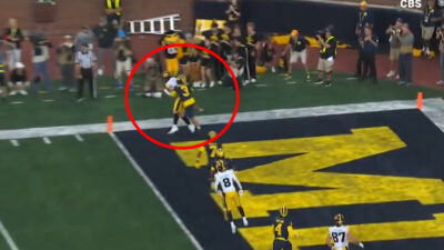 Iowa's Reece Vander Zee scores a touchdown to beat Michigan