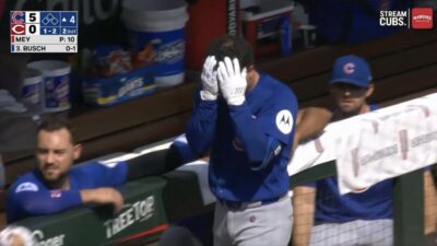 Cubs star Alex Bregman covering his eye after getting hit by a foul ball