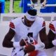 Deshaun Watson cleaning his visor