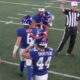 Jaxson Dart handing the game ball to Malik Nabers after Giants beat Cowboys