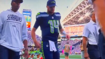 Sam Darnold limping off the field