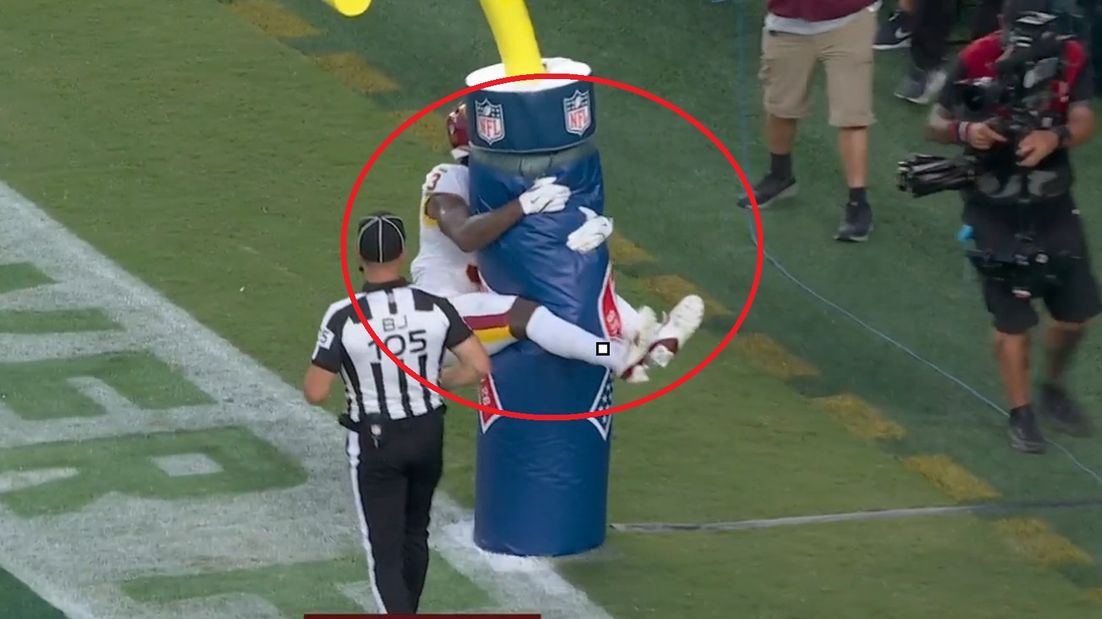 Stefon Diggs jumping on the goalposts