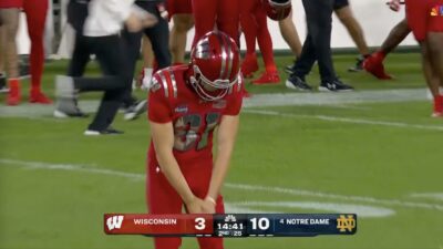 Wisconsin punter Sean West celebrating after executing a perfect punt against Notre Dame