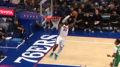 76ers' LeBron James throws down an alley-oop dunk.