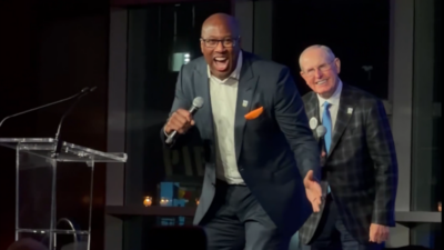 Tom Coughlin and Mike Brown signing.