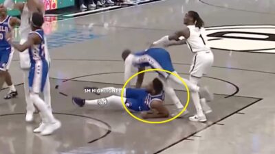 Joel Embiid falling into Jaylen Brown