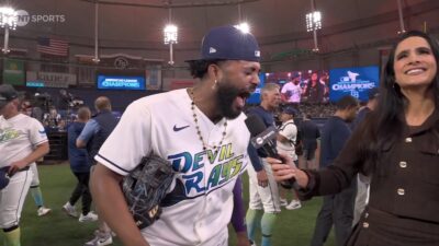 Rays star Junior Caminero yelling into a mic with a message copying LeBron James